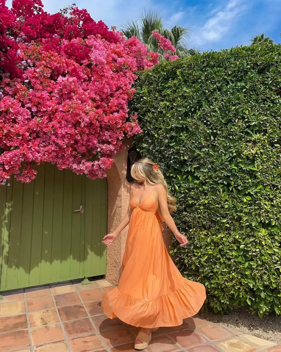 Effortless summer vibes with a flowy orange dress