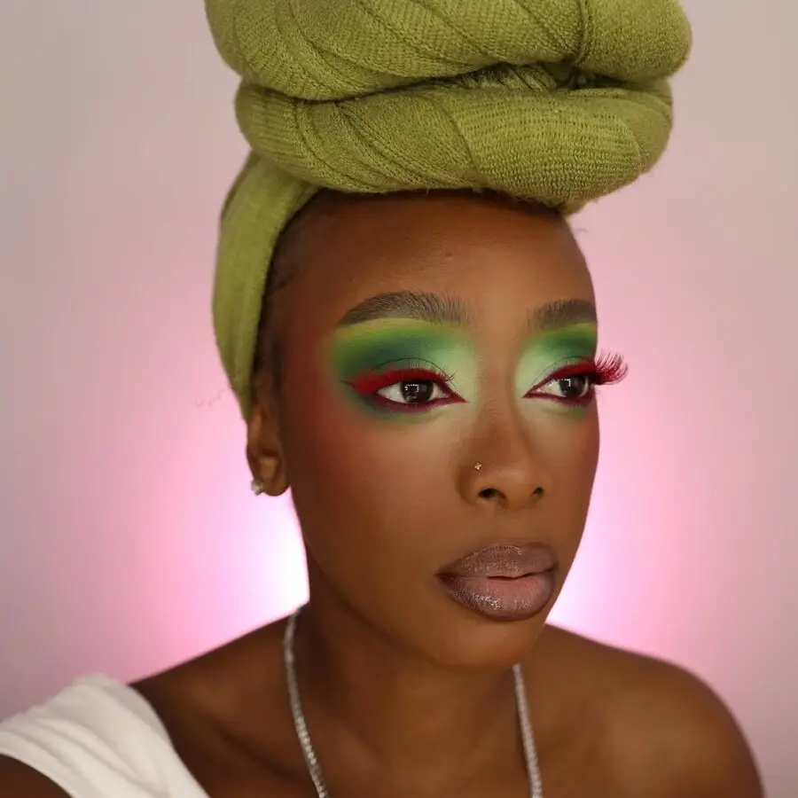 Vibrant green eyeshadow with soft nude lips
