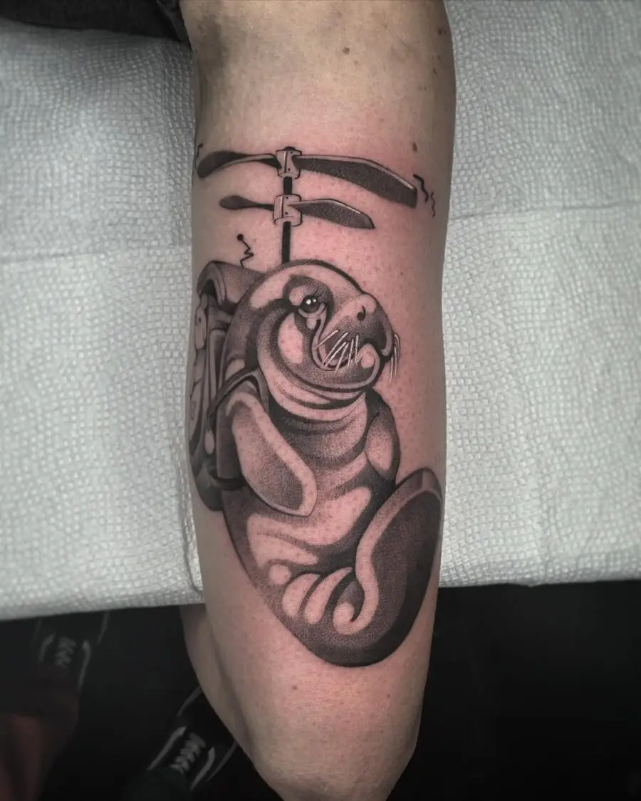 Charming manatee tattoo with a playful vibe