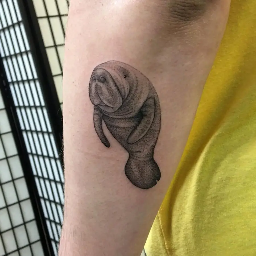 Charming manatee tattoo reflecting oceanic vibes