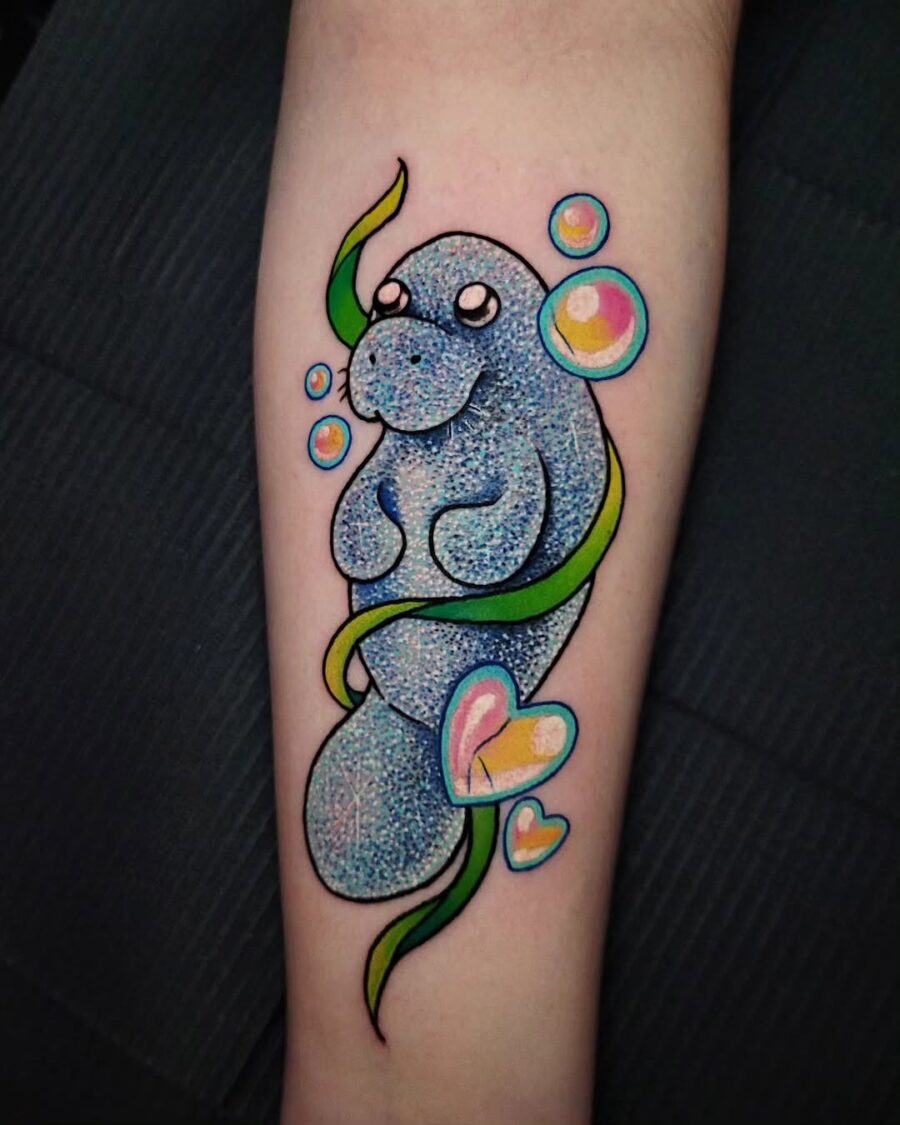 Cute manatee tattoo with vibrant bubbles and colors