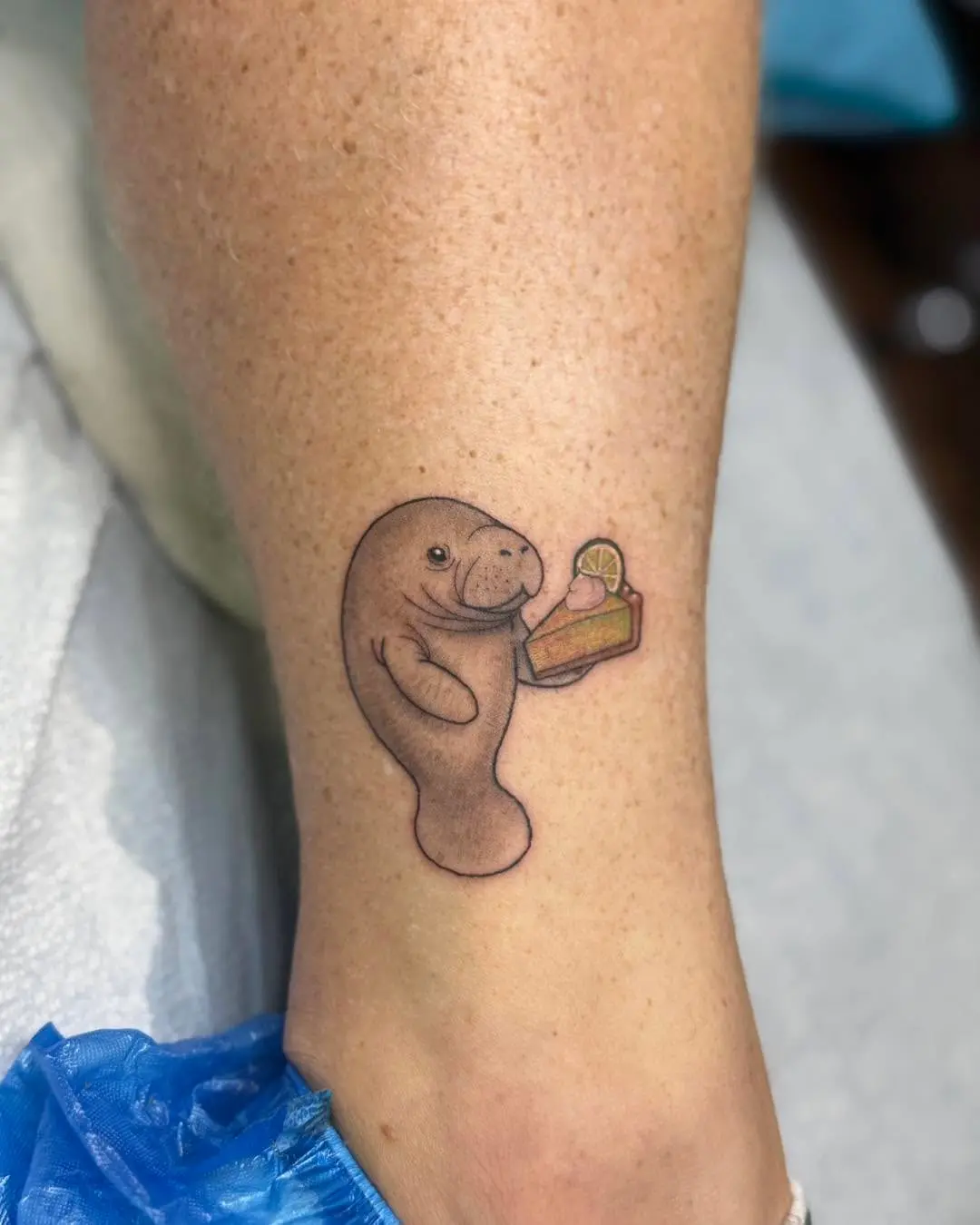 Charming Manatee Tattoo with Food Element