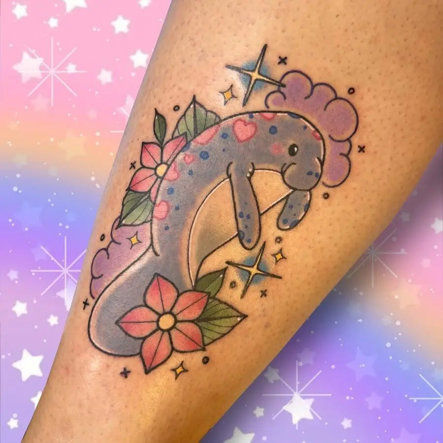 Whimsical manatee tattoo with floral accents