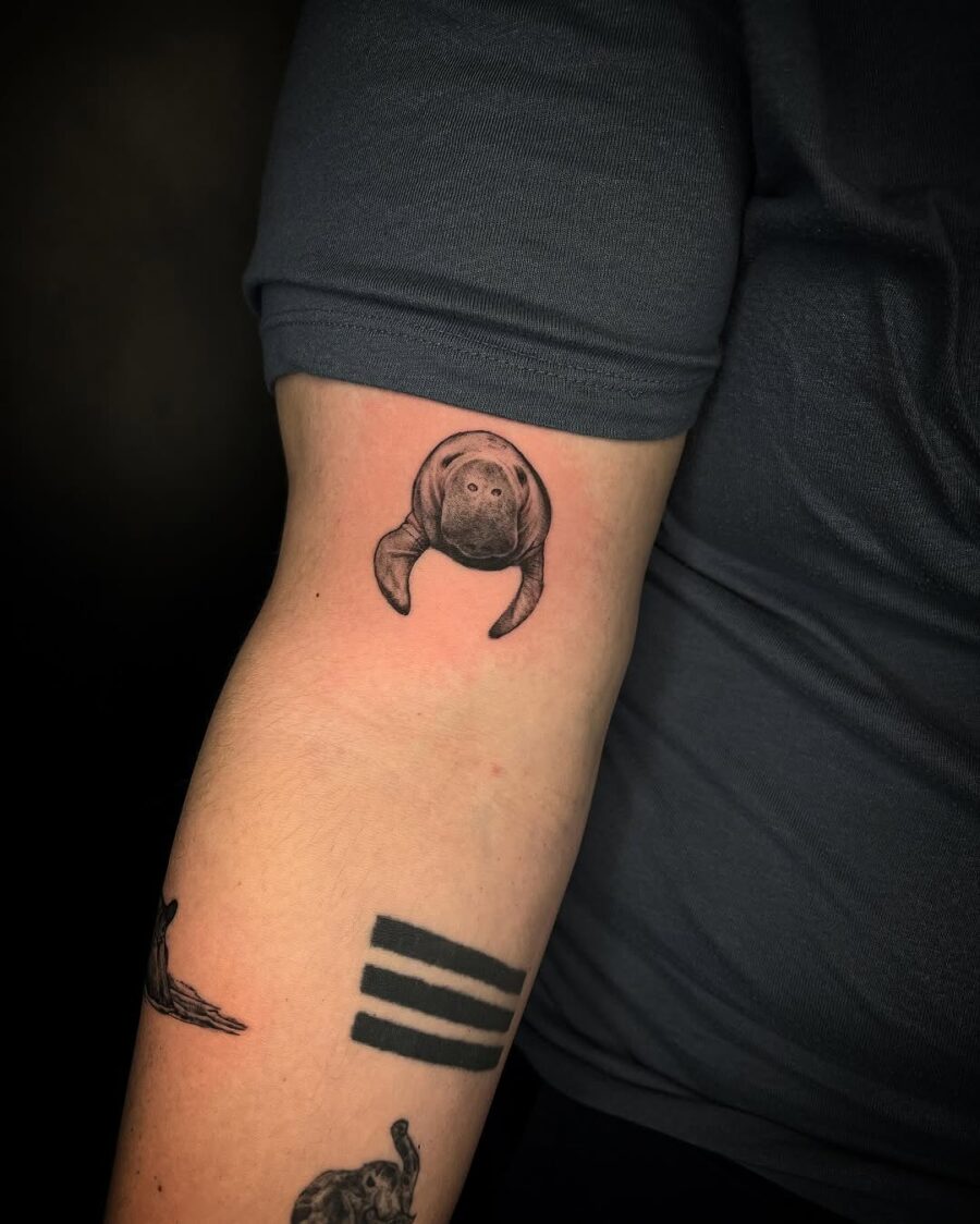 Realistic Manatee Tattoo on Forearm