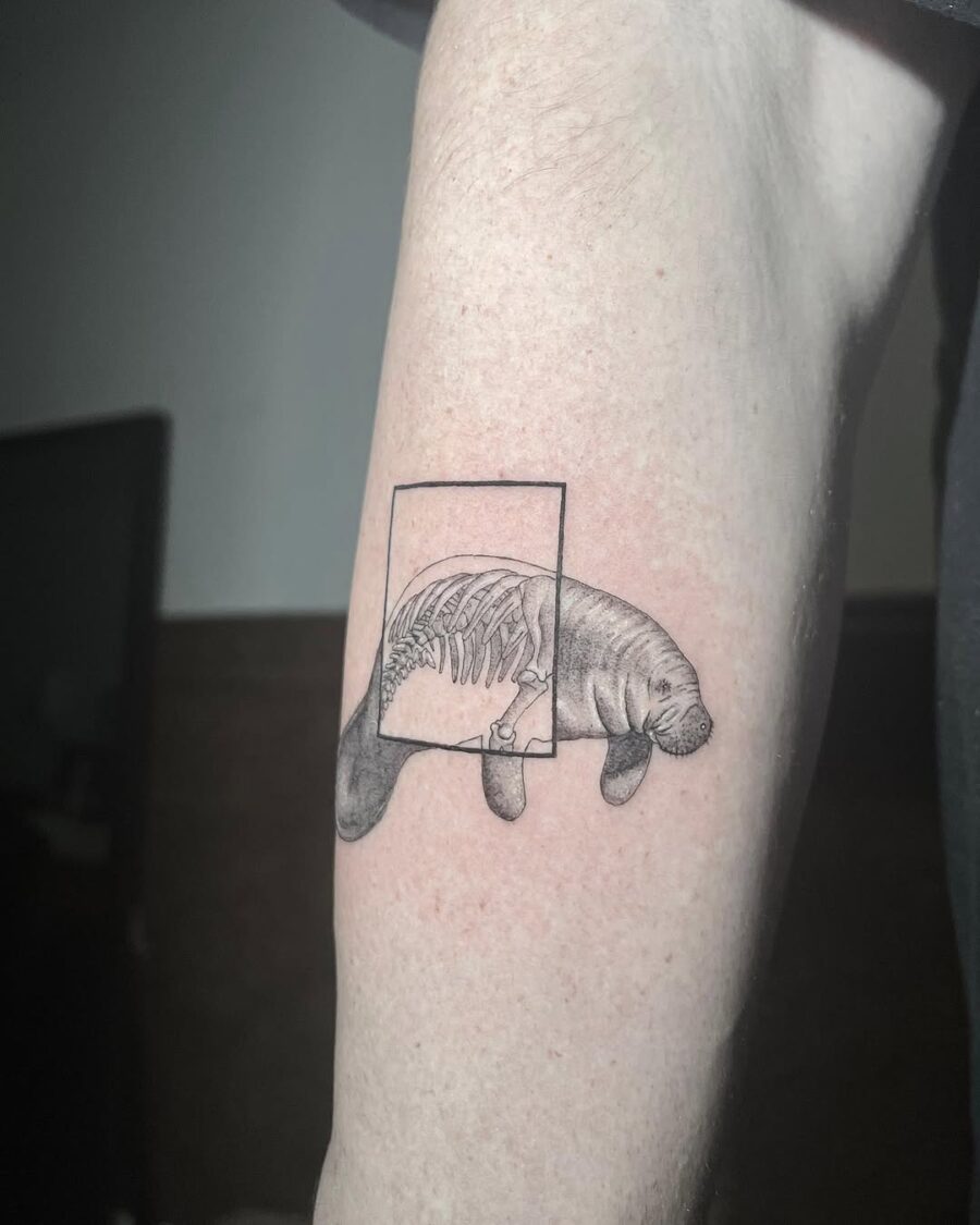 Unique manatee tattoo with ribcage design
