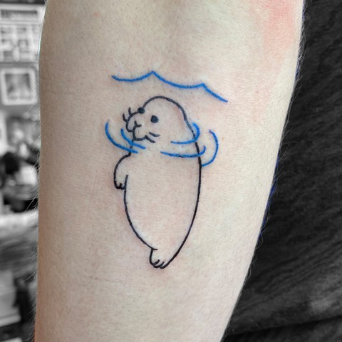 Charming Manatee Tattoo with Minimalist Design