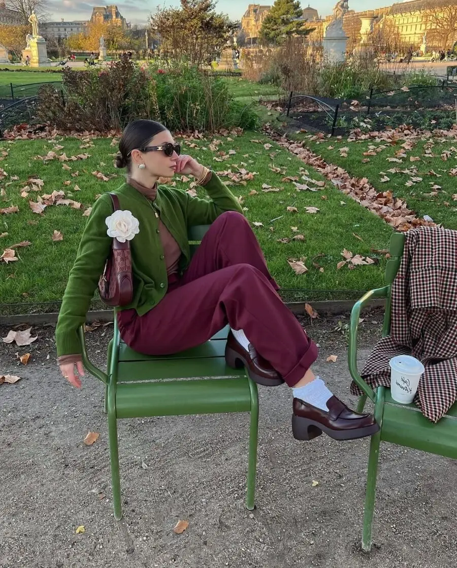 Chic maroon pants look in a serene garden
