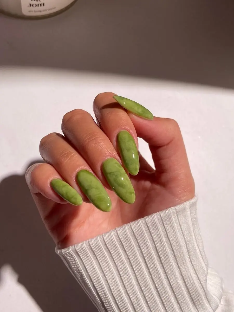 Trendy matcha green almond-shaped nails