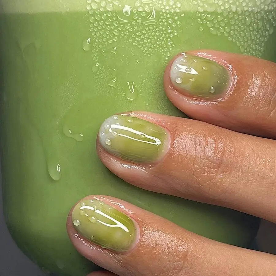 Refreshing and glossy matcha-inspired nail design.