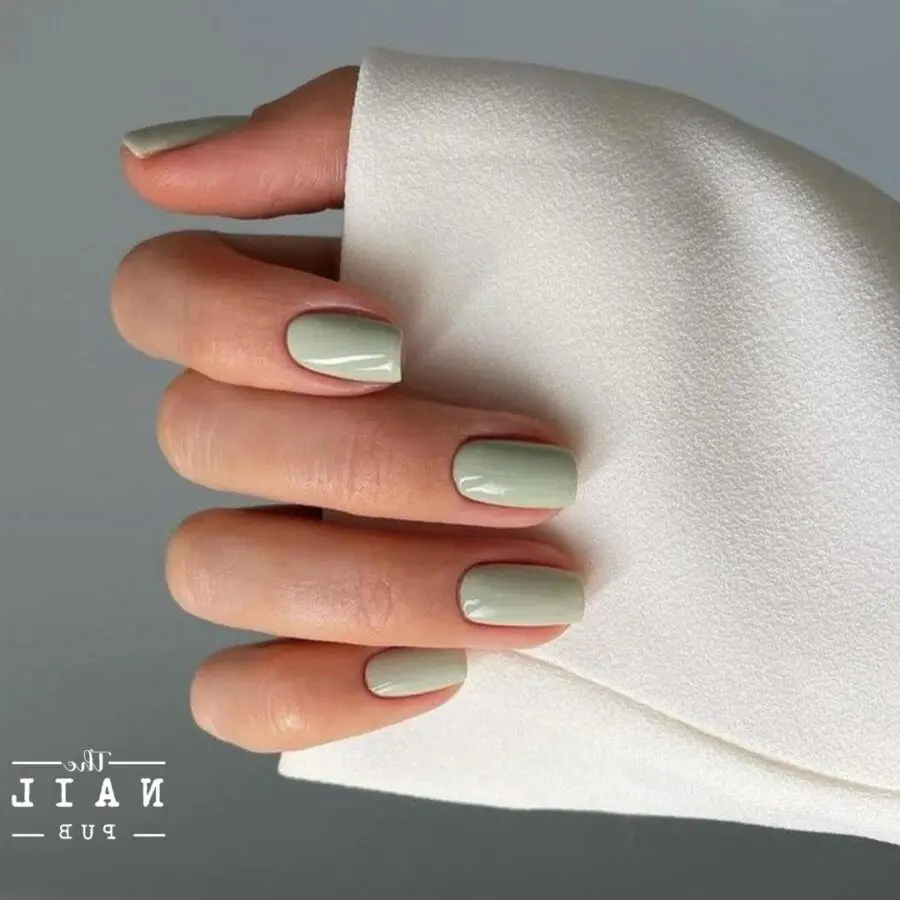 Elegant matcha green nail design on hand