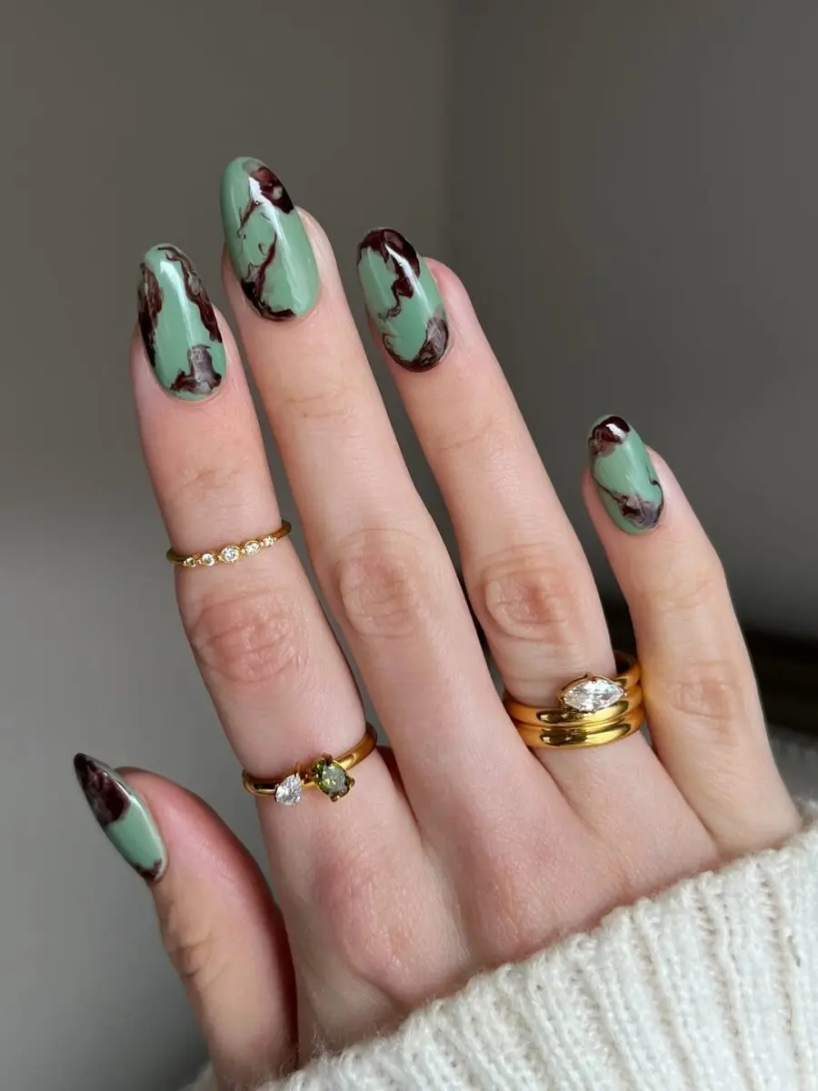 Stylish matcha nails with a marble twist