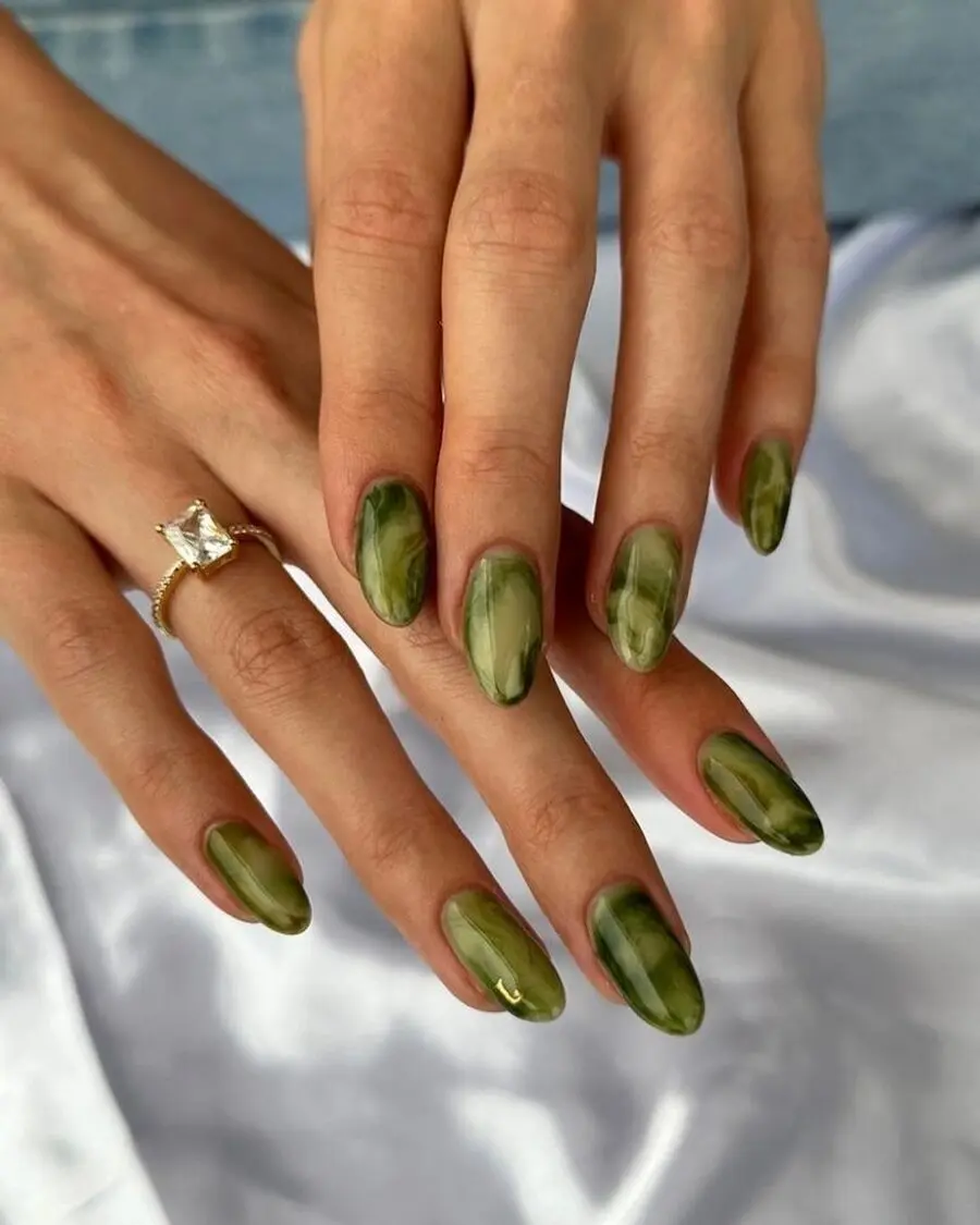 Stylish green marbled matcha nail design