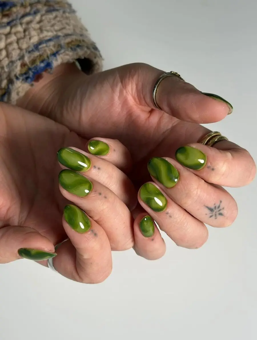 Vibrant matcha nails with marbled designs