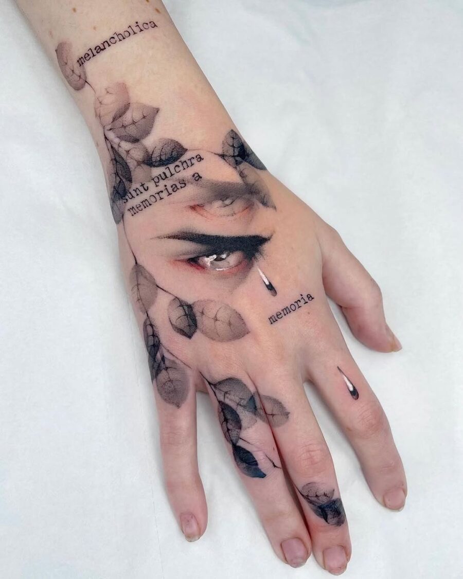 Expressive hand tattoo with nature elements