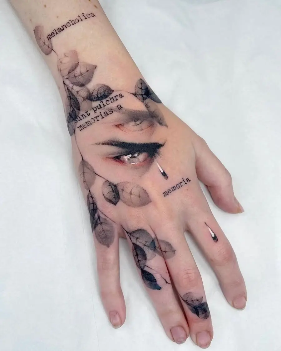 Expressive hand tattoo with nature elements