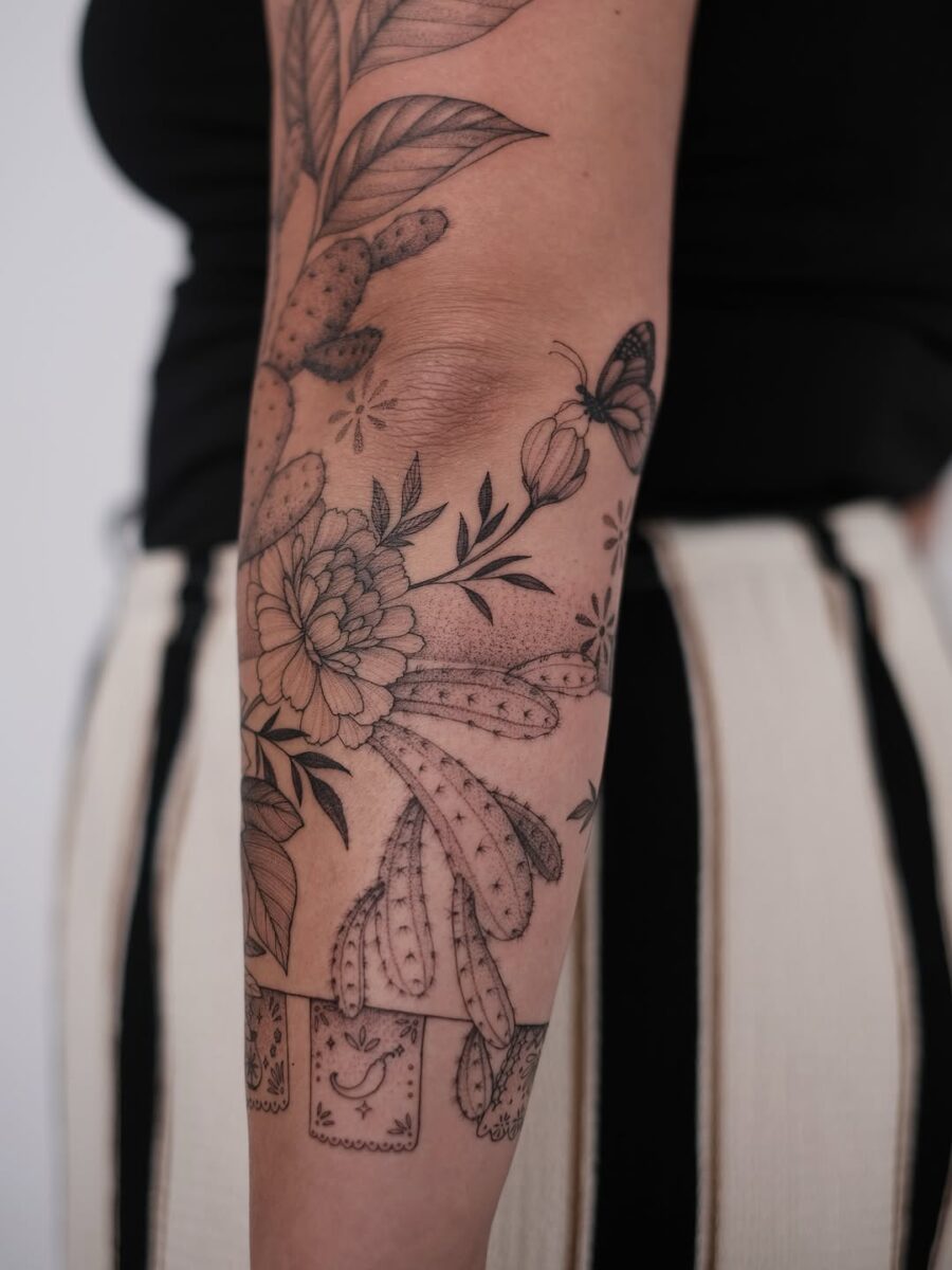 Elegant cactus and floral tattoo design