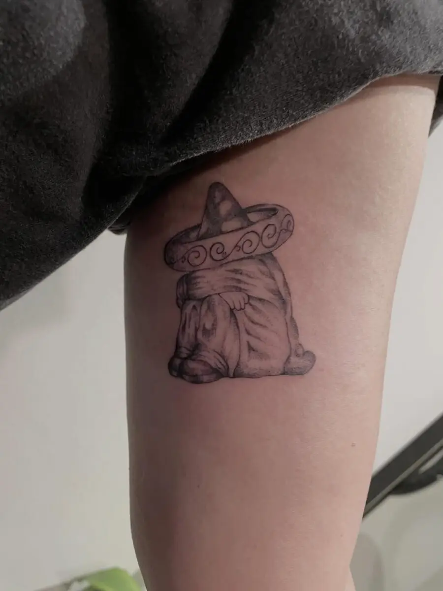 Unique Mexican cow tattoo with sombrero design