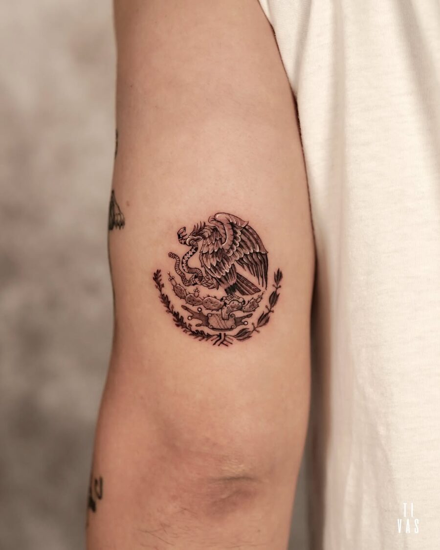 Symbolic Mexican tattoo featuring eagle and snake