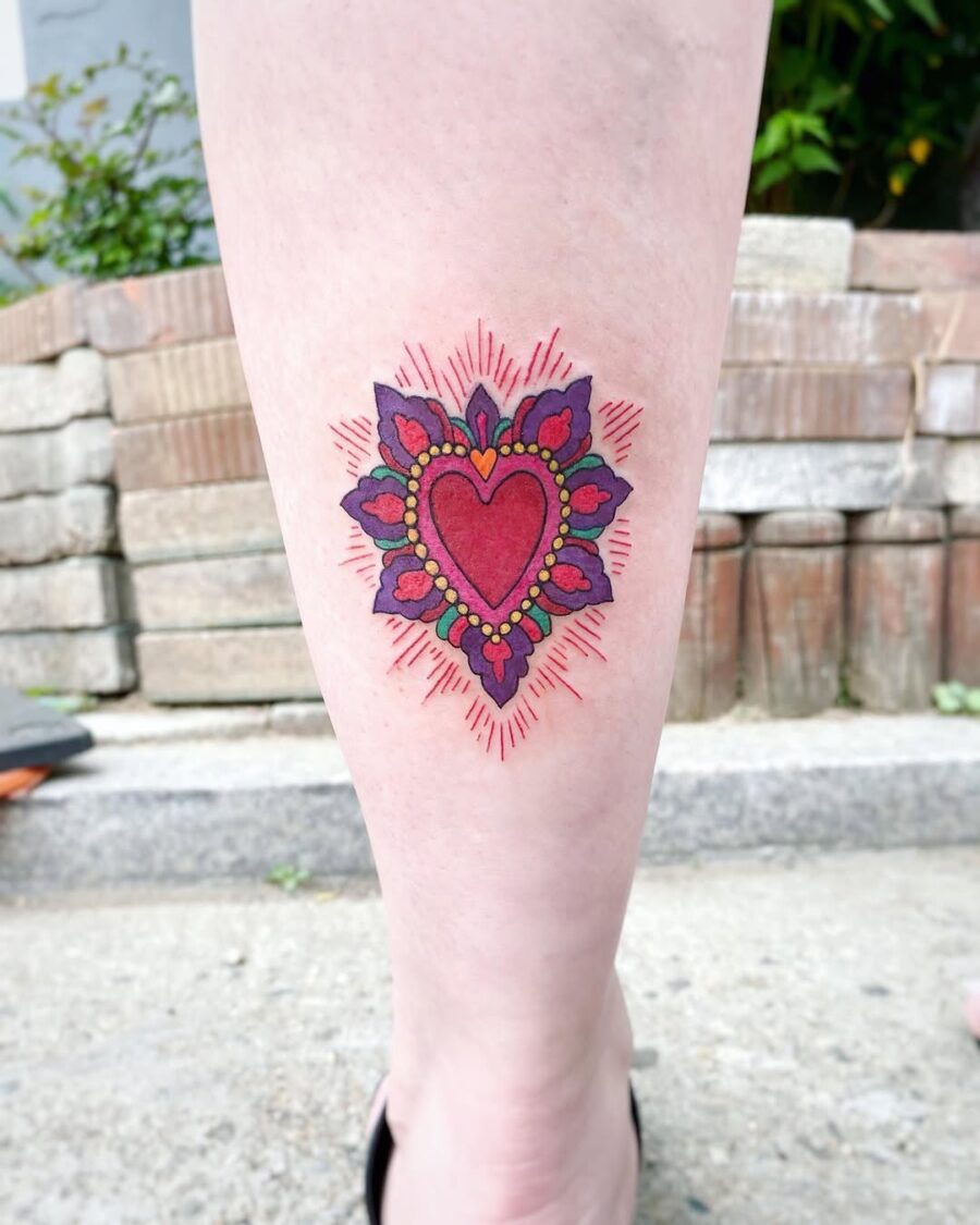 Vibrant heart tattoo with ornamental details