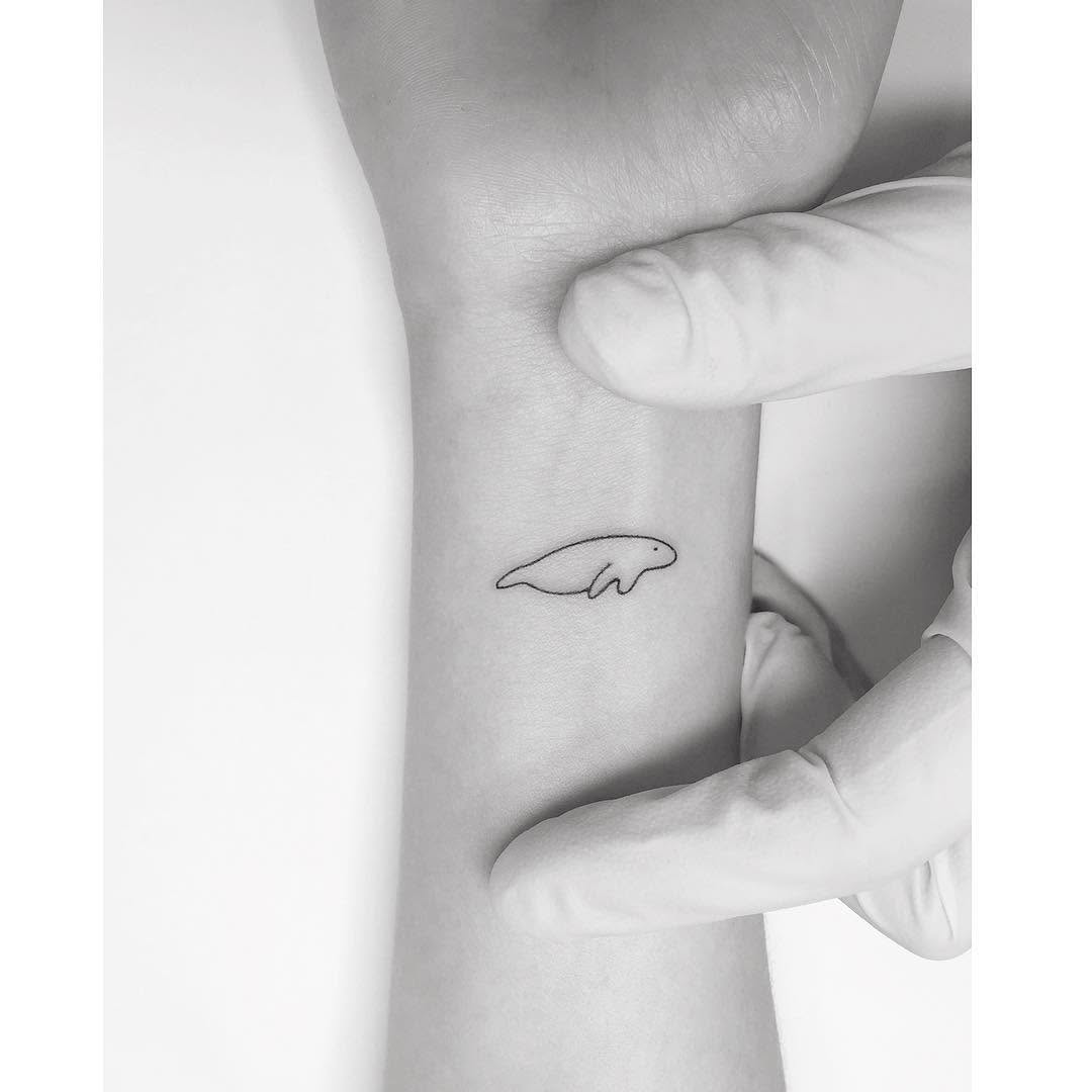 Charming Minimalist Manatee Tattoo Design