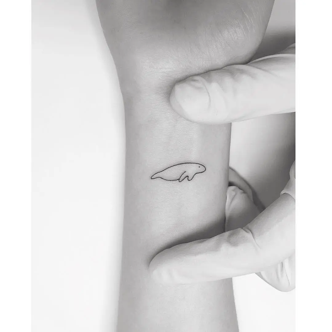 Charming Minimalist Manatee Tattoo Design