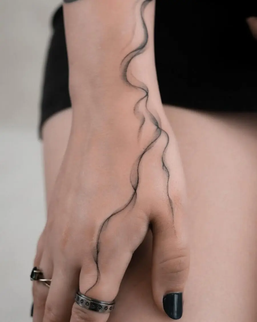 Elegant wave tattoo design on hand