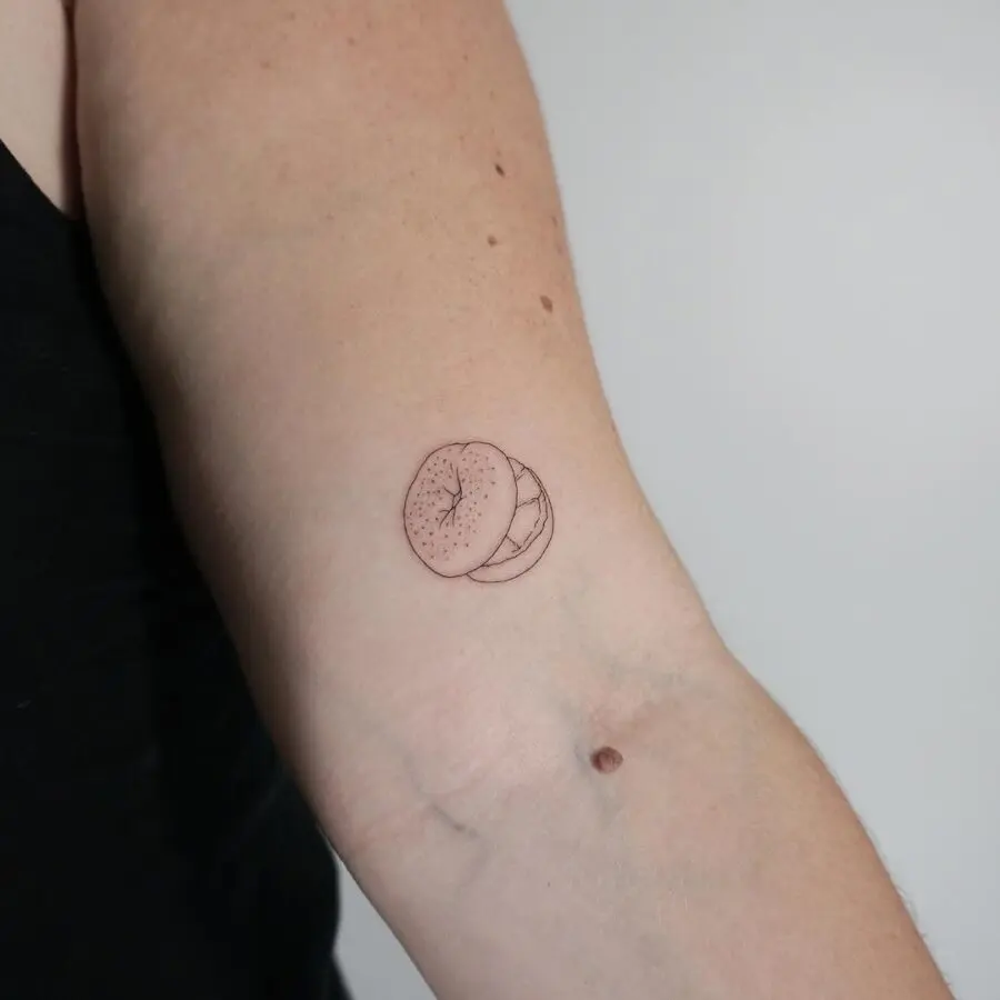 Charming bagel tattoo in a minimal style