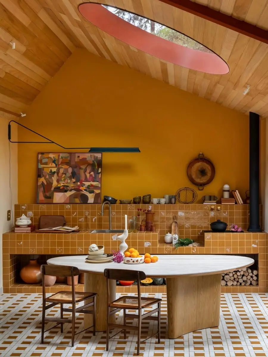 Stylish modern kitchen with warm yellow tones