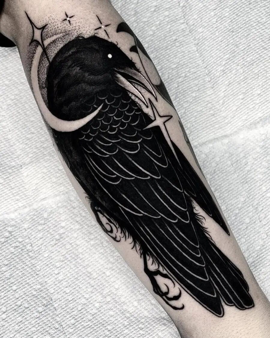 Elegant raven tattoo showcasing intricate black details