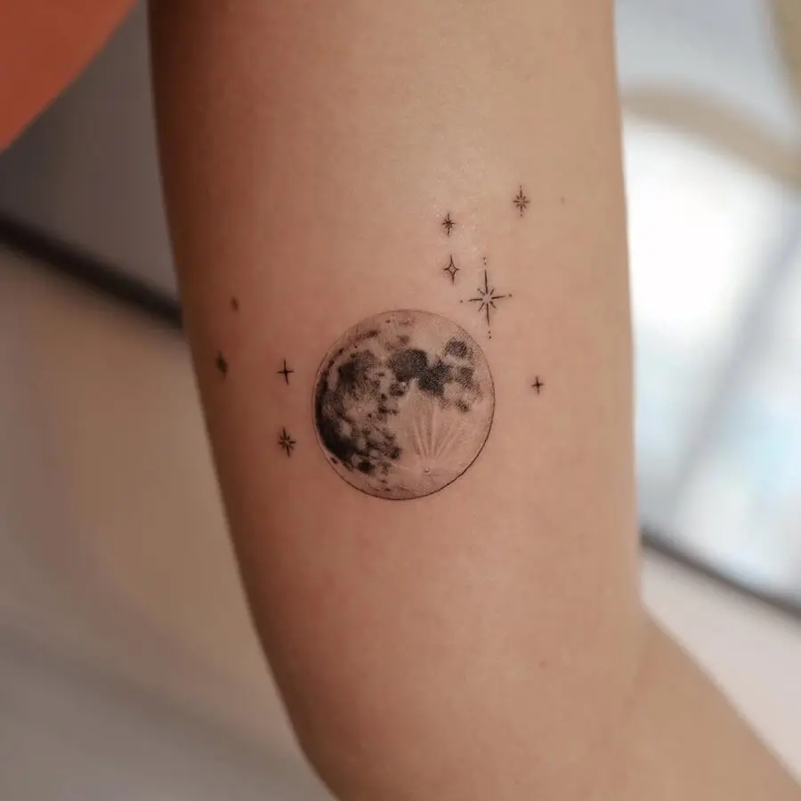 Stunning minimalist moon and star tattoo design
