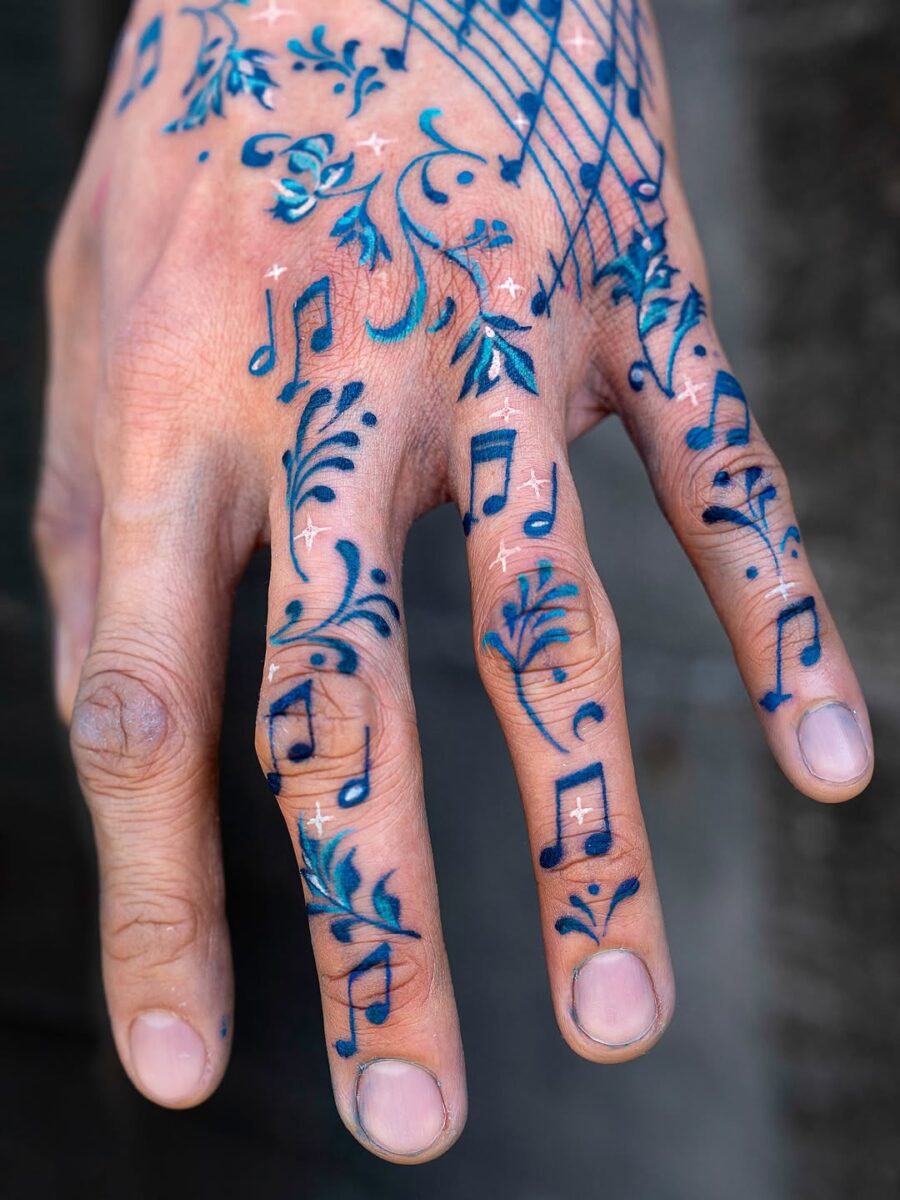 Vibrant Musical Note Tattoos Adorning a Hand