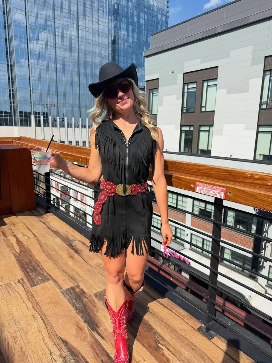 Stylish fringe dress with cowboy boots