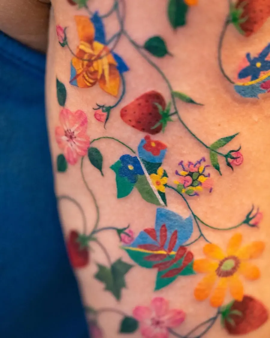 Vibrant floral designs in new school tattoos