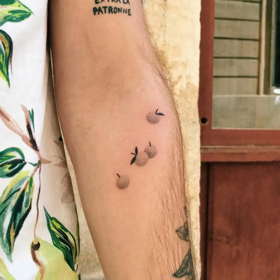 Delicate orange tattoo with minimalistic design