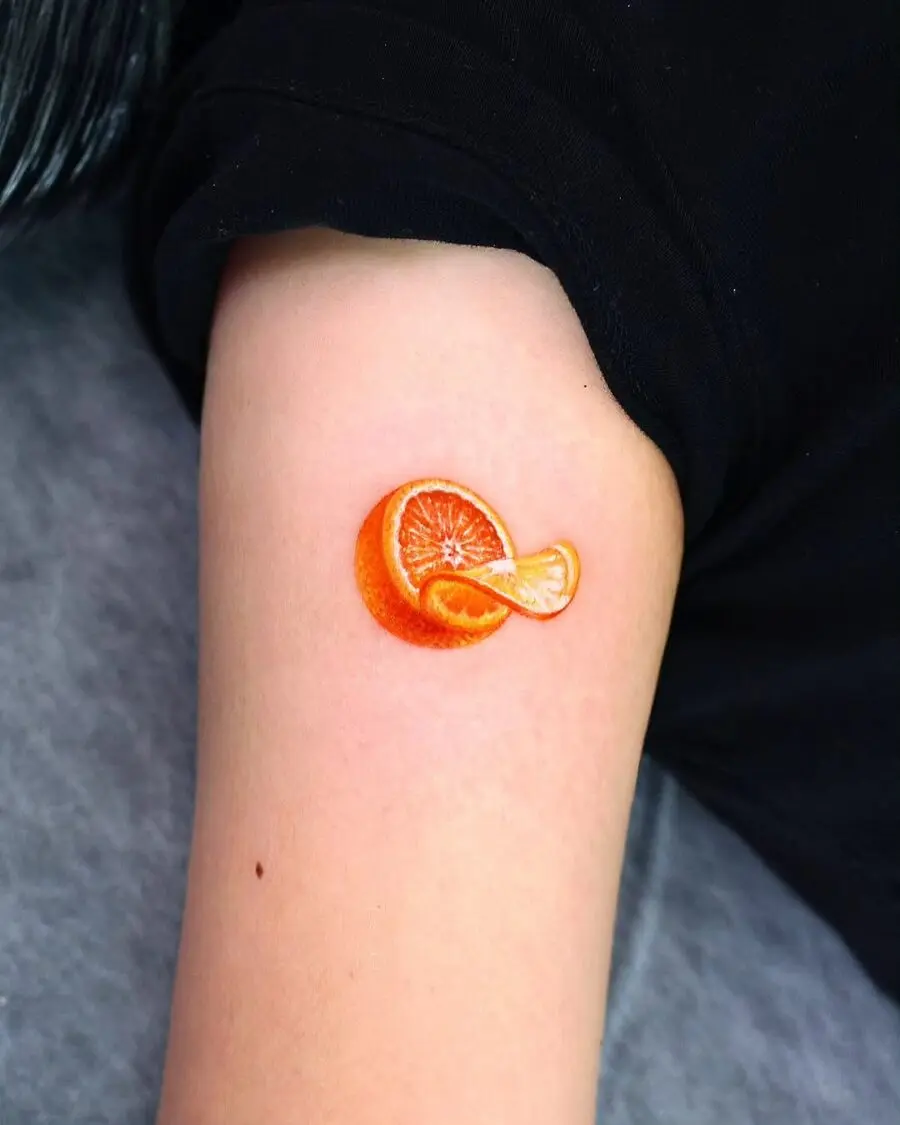 Vibrant orange tattoo with a realistic design