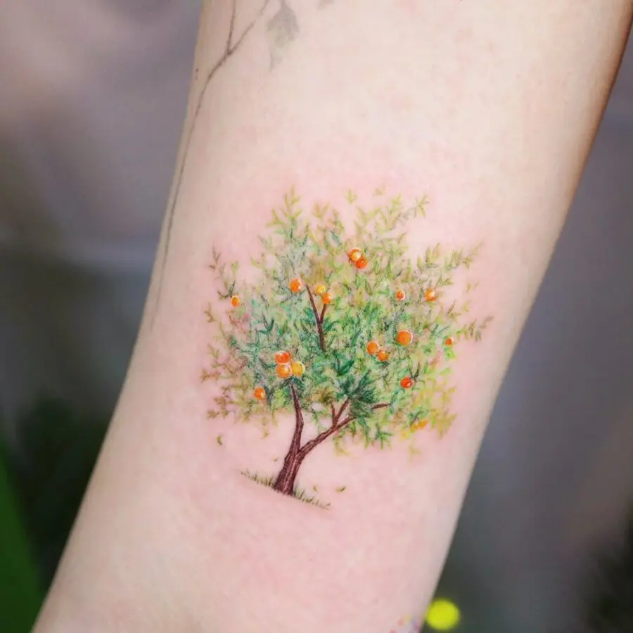 Vibrant orange tree tattoo symbolizing growth