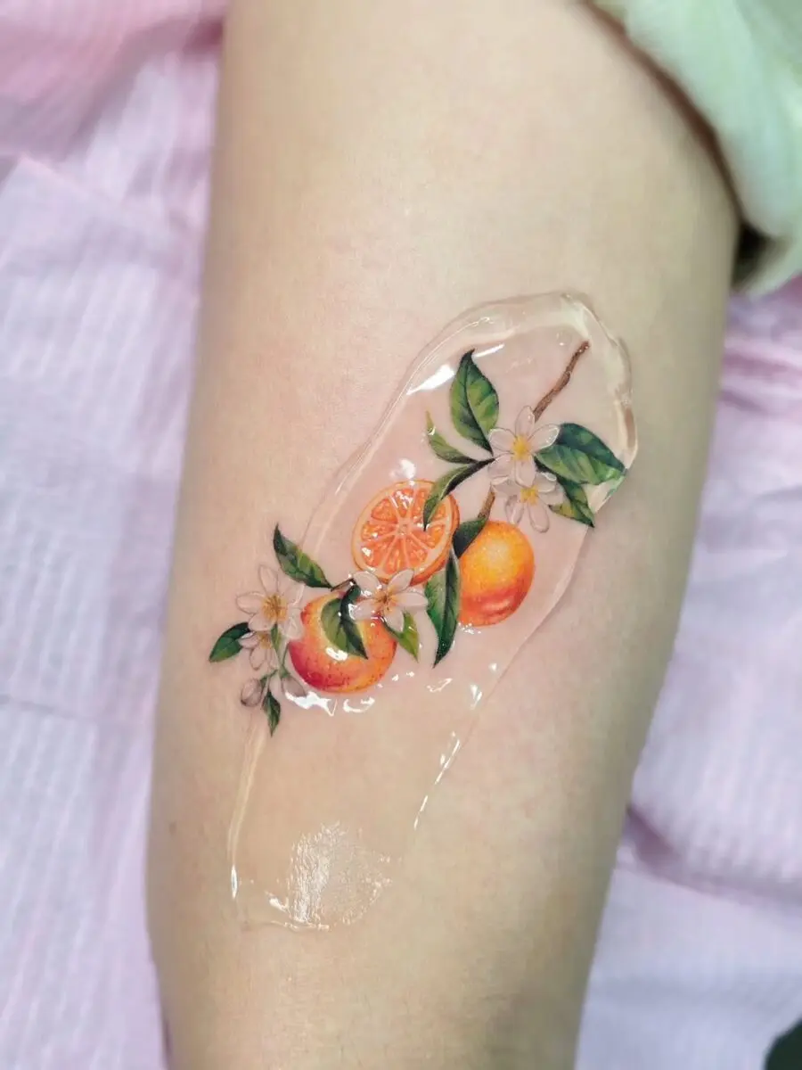 Vibrant Orange Tattoo with Floral Accents