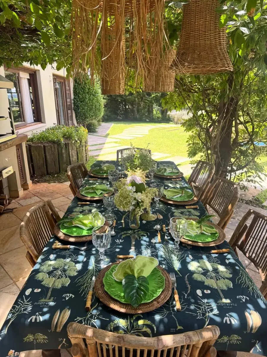 Elegant outdoor dining under lush greenery