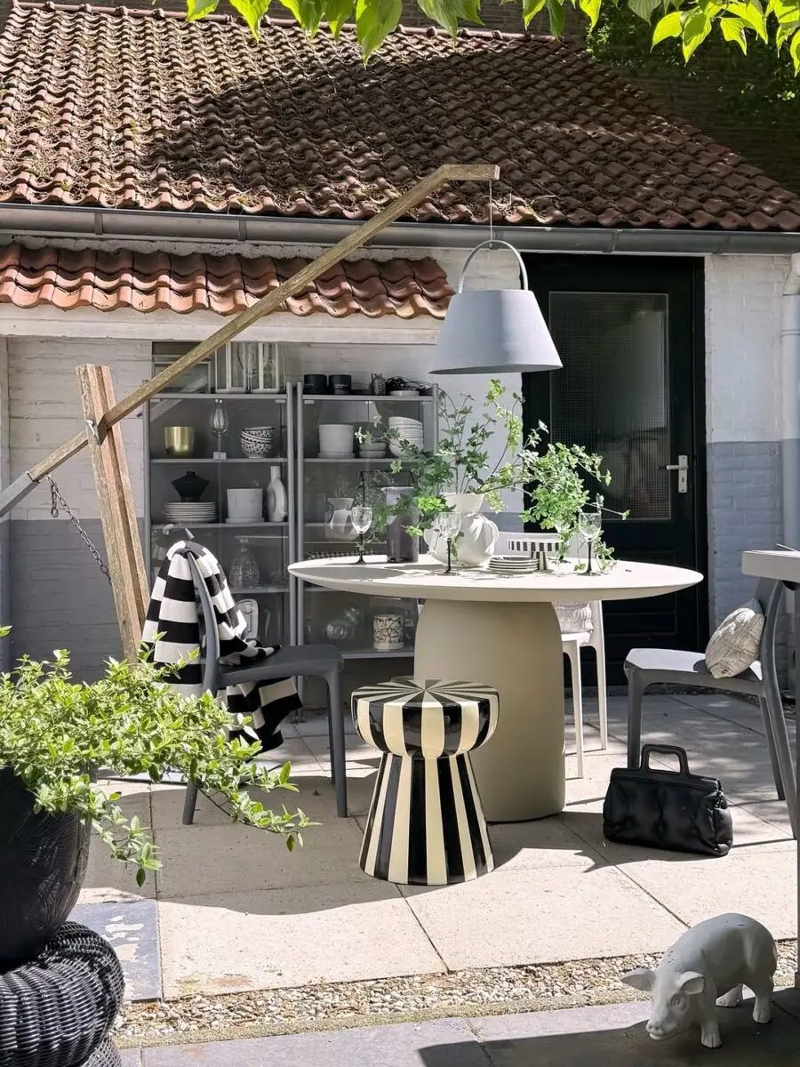 Stylish outdoor dining with striped accents