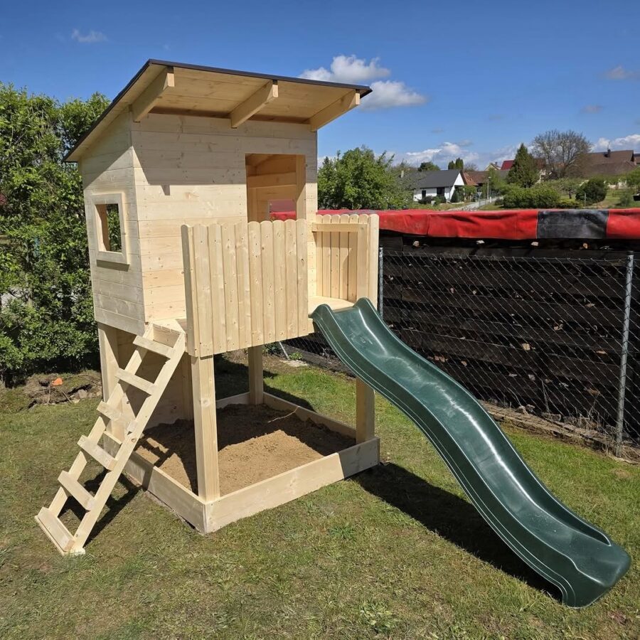 Charming wooden treehouse with slide