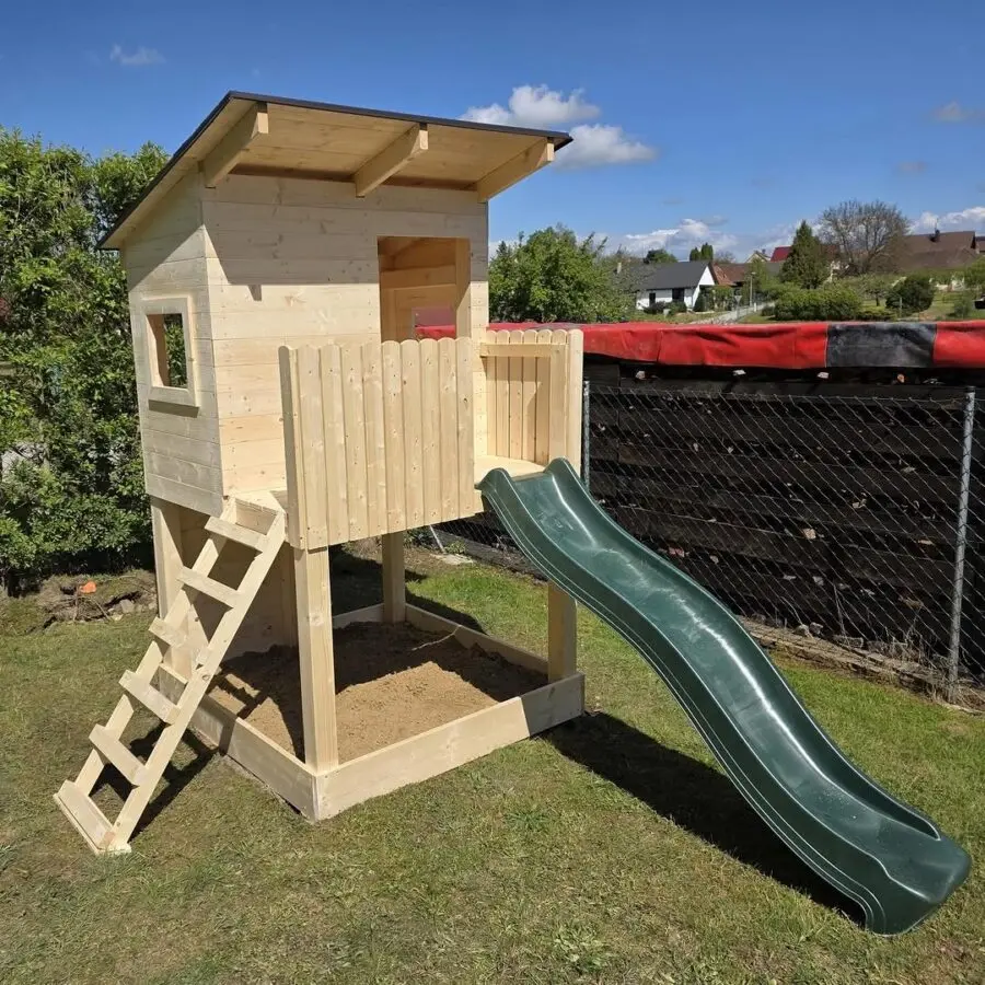 Charming wooden treehouse with slide