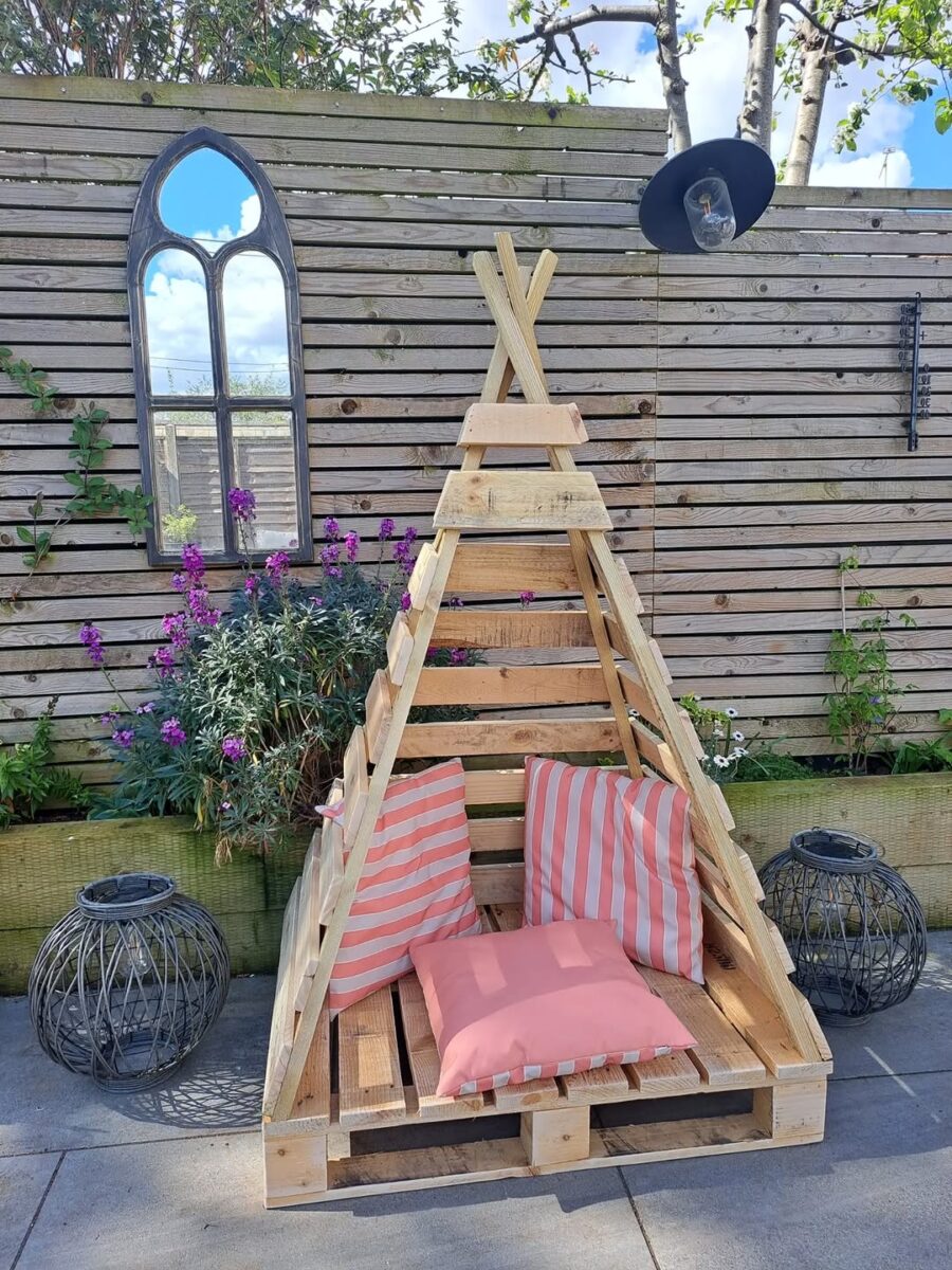 Charming pallet teepee for cozy outdoor seating