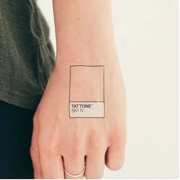 Minimalist Pantone tattoo on wrist