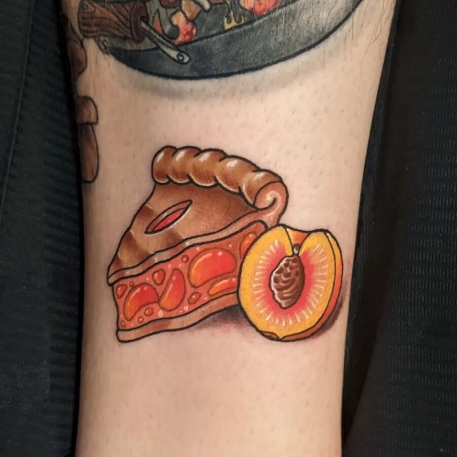 Whimsical peach pie tattoo with fresh fruit