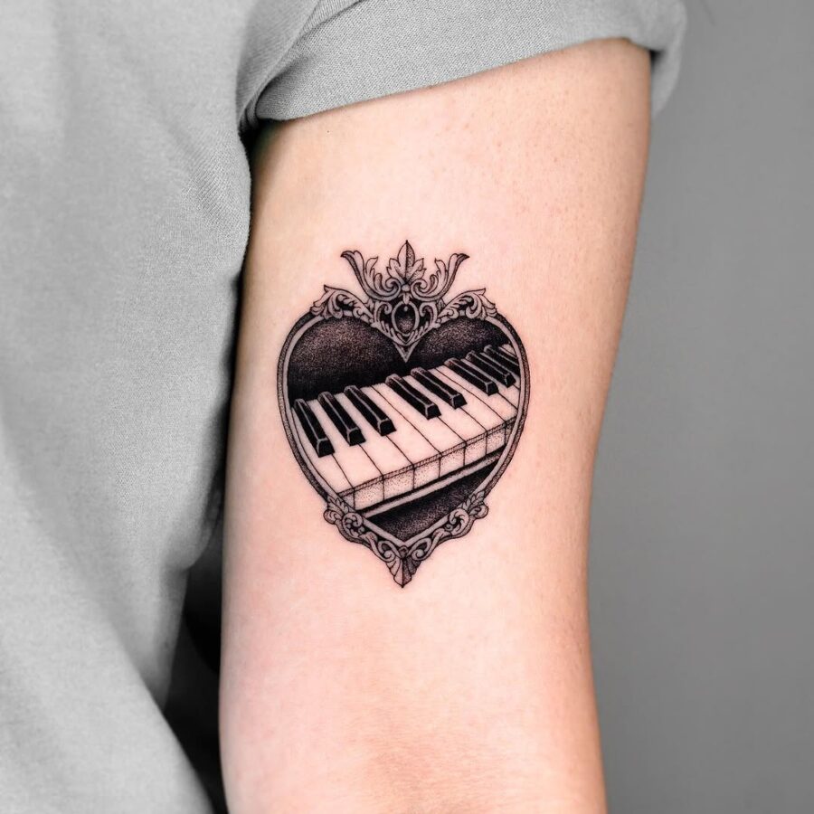 Elegant piano tattoo inside a heart design