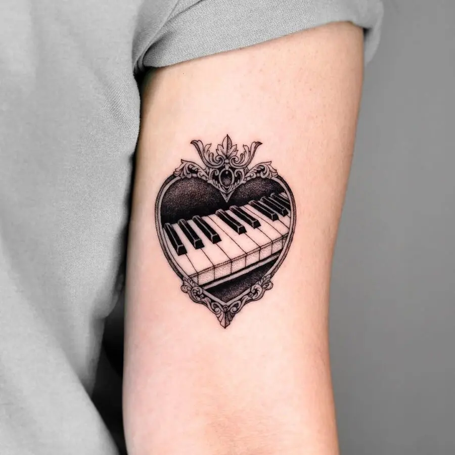 Elegant piano tattoo inside a heart design