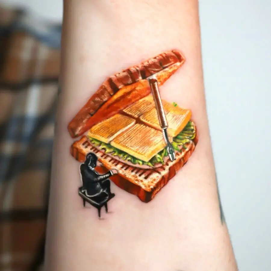 Whimsical piano sandwich tattoo design