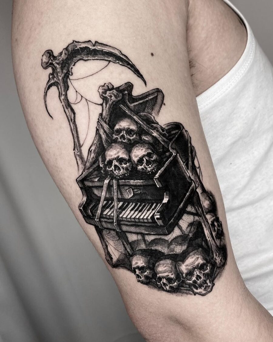 Dark piano tattoo with skeletal vibes