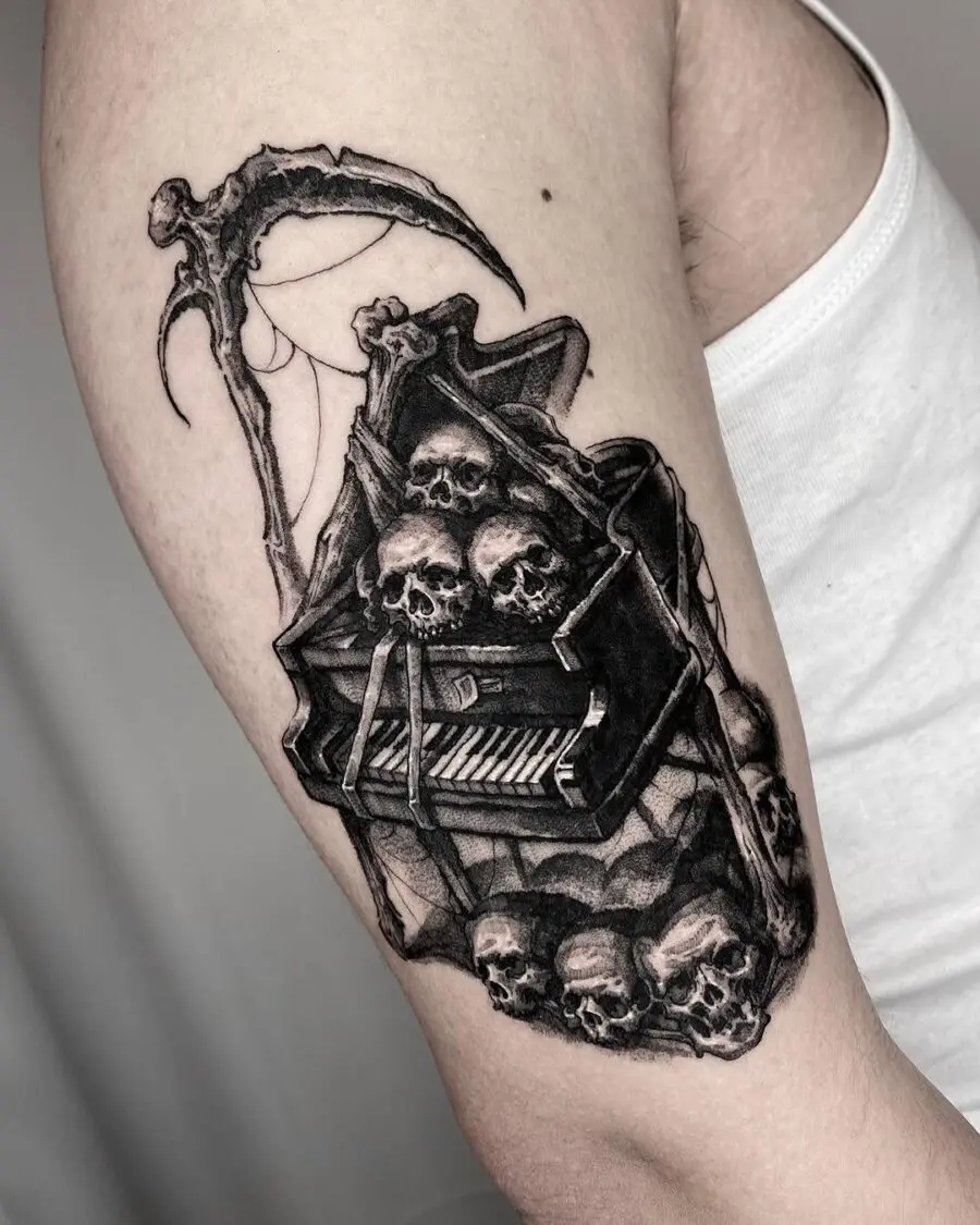 Dark piano tattoo with skeletal vibes