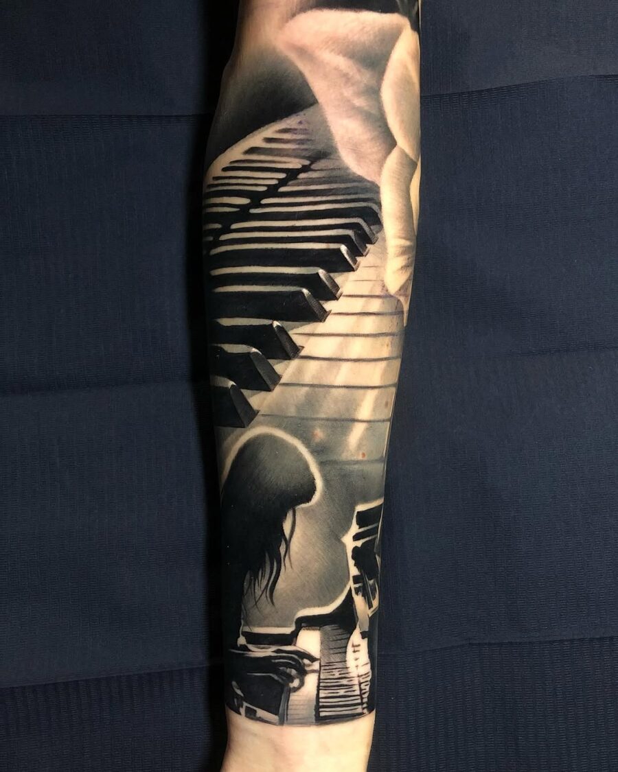Intricate piano tattoo creating musical harmony
